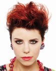 Flamboyant red pixie with lifted top hair and finger styling