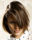Chin length hair with much texture and diagonal styling