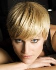 Blonde pixie cut with curved lines and movement