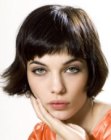 Short bob haircut with a soft outline and rounded corners