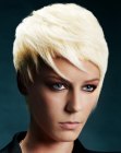 Platinum blonde pixie cut with volume on top of the head