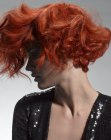 Wavy and curly red hair with a giant fringe