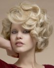 Blonde mid neck length hair with large retro 1960s curls