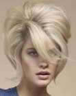 Short hairstyle with top volume, sweeping bangs and flipped out ends