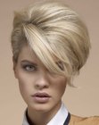Poufy short hairstyle with long sweeping bangs and 1960s elements