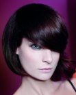 Sleek bob with a deep curved fringe and asymmetry