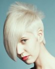 Short platinum blonde hair with elements of punk looks
