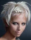 Short platinum blonde hair with spiked ends and a braided hairband