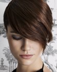 Snug short hairstyle with long wrap around bangs