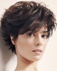 Longer pixie cut with gradual lengthening and flipped up tips