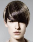 Short haircut with deep plunging bangs and highlights
