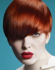 Short red hair with deep bangs that cover one eye