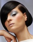 Short and satiny raven black hair with an elegant shape