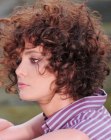 Short brunette hairstyle with a round shape and curls