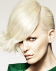Short blonde hair with elongated bangs and buffed up volume