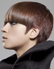 Stylish short haircut with contrasting textures and cutting lines