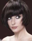 Short brunette bob with asymmetry and tilted bangs
