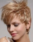 Blonde pixie cut with layers and wispy styling