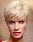 Blonde pixie haircut with side bangs and textured tips