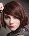 Metropolitan bob haircut with blunt cutting lines and side bangs
