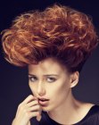 Short hairstyle with lifted copper color hair and curls