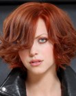 Layered bob with volume in the roots and curls