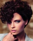 Very short top heavy hairstyle with curls