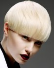Blonde bowl cut hair with precise cutting lines