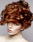 Modern short hairstyle with curls and volume