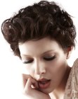 Short curly hairstyle with all hair styled out of the face