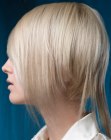 Short haircut with reversed layers and a partially graduated nape