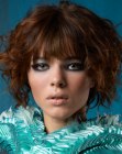Short hairstyle with curls and sleek eyebrow length bangs