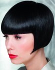 Short black bob haircut with a slick and shiny surface