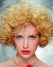 Short blonde hair with volume and bouncing curls