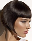 Sleek short bob with pointy tips and above the eyebrows bangs