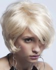Short blonde hairstyle with volume and vintage flair