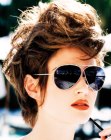 Short layered hairstyle with sideburns for women