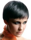 Spectacular short haircut with textured lines and a shiny surface