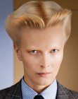 Androgynous short hairstyle with the hair brushed up and backwards