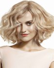 Blonde trapeze shape bob with huge waves