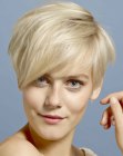 Very short haircut with pointed bangs for blonde hair
