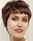 Flattering brunette pixie cut with short textured bangs