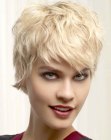 Feisty short hairstyle with curls and textured tips
