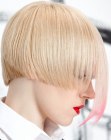 Short blonde hair with disconnected bangs and pink streaks