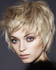 Short layered hairstyle with the hair pulled into the face