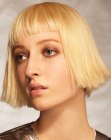 Modern bob with sharp cutting lines and slanted bangs
