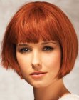 Copper chin length bob with just above the eyebrows bangs