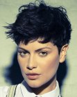 Pixie cut with disheveled styling and mini sideburns