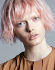 Pink hair cut to a bob with slice cut tips