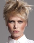 Short blonde hair with wild bangs and black accent strands